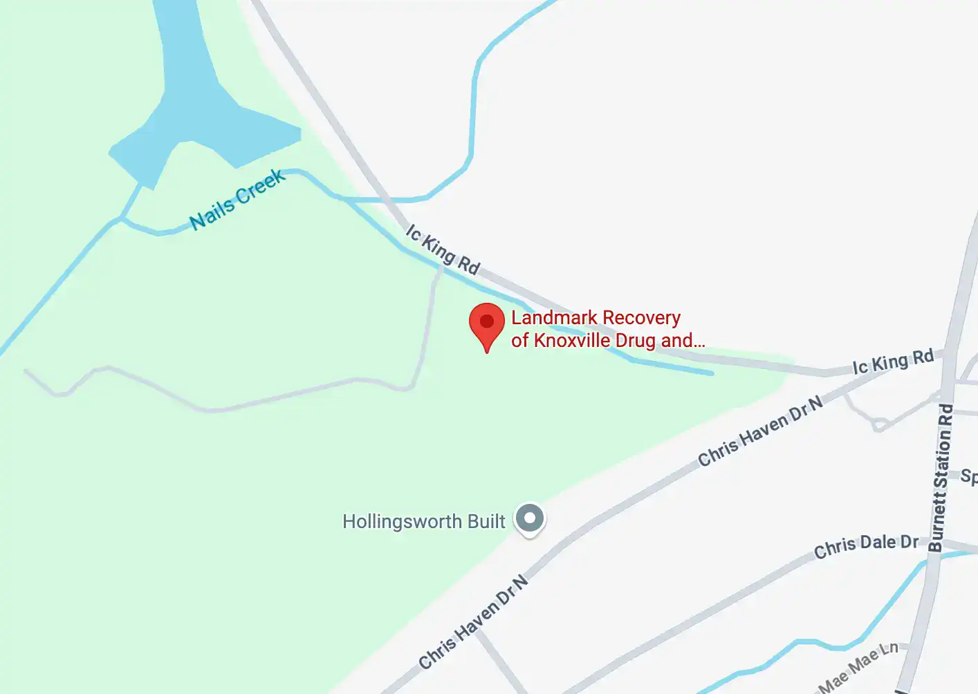 Map highlighting Summit at Knoxville with a red location marker. The map features a light green background representing topographic lines or landscape features.